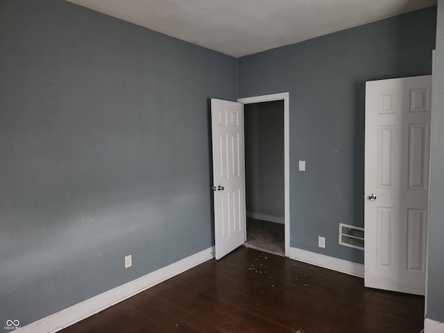 2707-2709 N College Ave, Indianapolis, IN 46205 - unfurnished bedroom with wood finished floors and baseboards