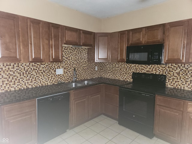 2707-2709 N College Ave, Indianapolis, IN 46205 - kitchen with black appliances, a sink, dark countertops, backsplash, and light tile patterned flooring