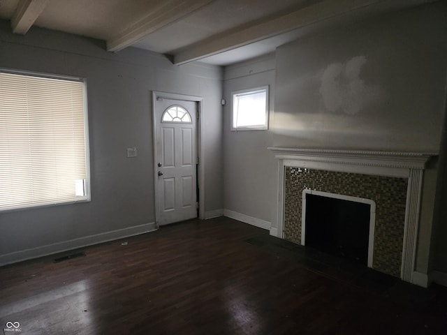 2707-2709 N College Ave, Indianapolis, IN 46205 - entrance foyer with beamed ceiling, dark wood-type flooring, a tiled fireplace, and baseboards