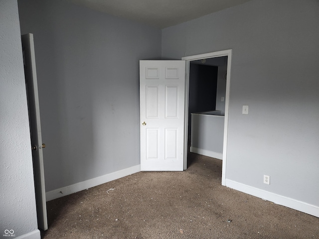 2707-2709 N College Ave, Indianapolis, IN 46205 - unfurnished bedroom with carpet flooring and baseboards