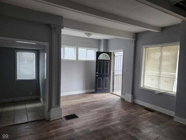 2707-2709 N College Ave, Indianapolis, IN 46205 - foyer featuring beamed ceiling, baseboards, wood finished floors, and decorative columns
