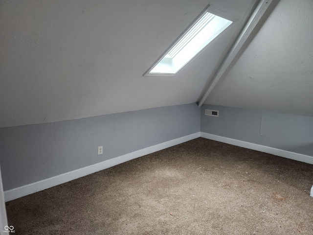 2707-2709 N College Ave, Indianapolis, IN 46205 - bonus room with a skylight, baseboards, and carpet floors