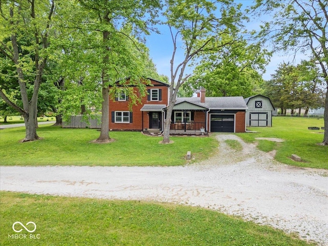 210 N Pleasant Run, Crawfordsville, IN 47933 - view of front of property with a garage, driveway, a porch, a front yard, and brick siding