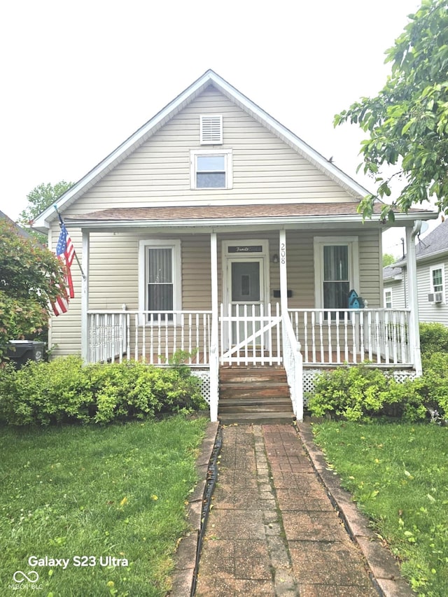 208 E Madison St E, Alexandria, IN 46001 - bungalow featuring a porch and a front yard