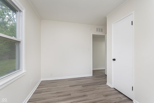 625 E 106th St, Carmel, IN 46280 - unfurnished room featuring wood finished floors, ornamental molding, and baseboards