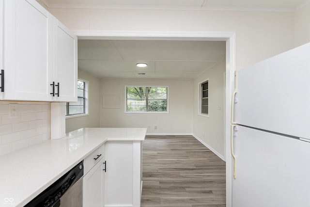 625 E 106th St, Carmel, IN 46280 - kitchen with freestanding refrigerator, light wood-style flooring, dishwasher, white cabinets, and tasteful backsplash