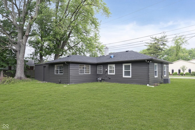 625 E 106th St, Carmel, IN 46280 - rear view of property with central AC, a lawn, a chimney, and a shingled roof