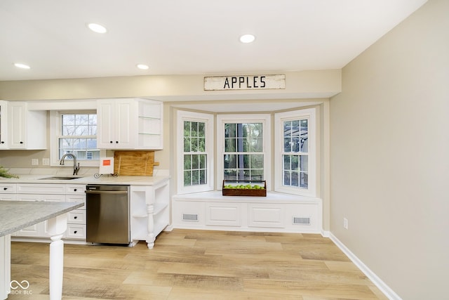 10245 Briar Creek Ln, Carmel, IN 46033 - kitchen with stainless steel dishwasher, a sink, open shelves, white cabinets, and light wood finished floors