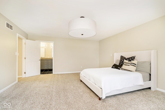 10245 Briar Creek Ln, Carmel, IN 46033 - carpeted bedroom featuring baseboards and ensuite bath