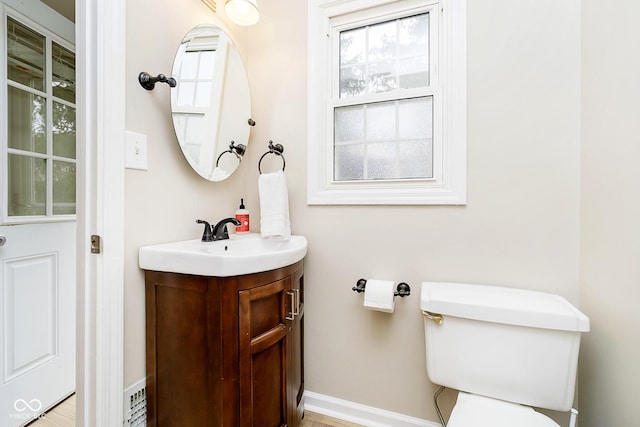 10245 Briar Creek Ln, Carmel, IN 46033 - half bathroom with vanity, baseboards, and toilet
