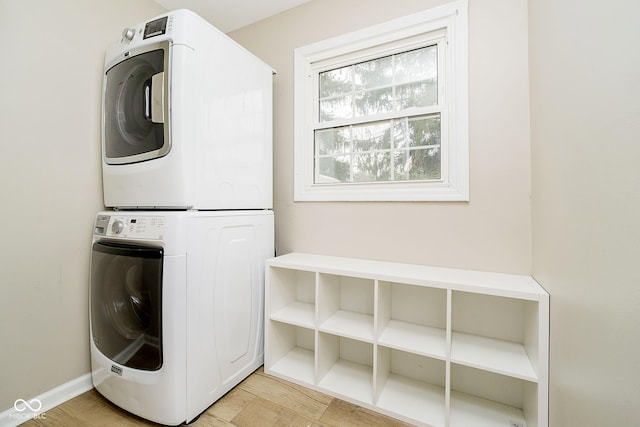 10245 Briar Creek Ln, Carmel, IN 46033 - laundry room with stacked washing machine and dryer and baseboards