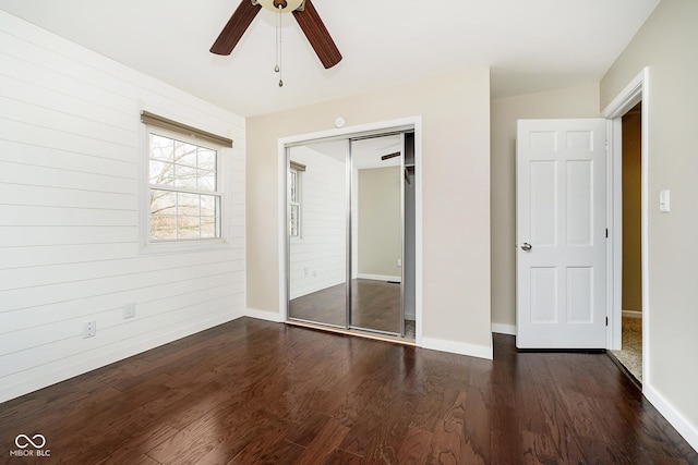 10245 Briar Creek Ln, Carmel, IN 46033 - unfurnished bedroom featuring a closet, wood finished floors, baseboards, and a ceiling fan