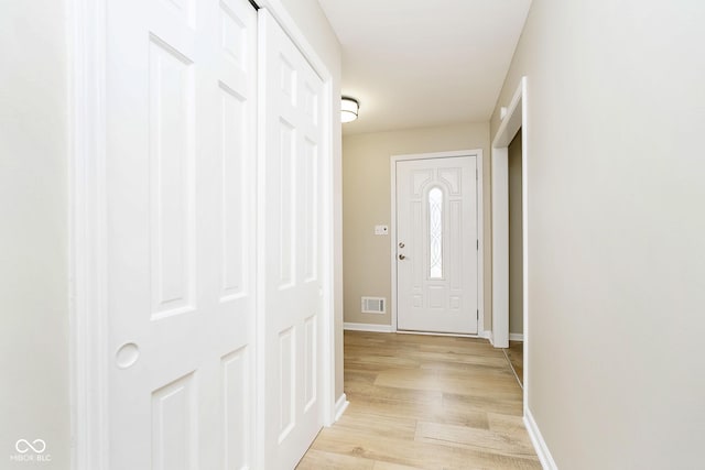 10245 Briar Creek Ln, Carmel, IN 46033 - doorway to outside with light wood-style floors and baseboards
