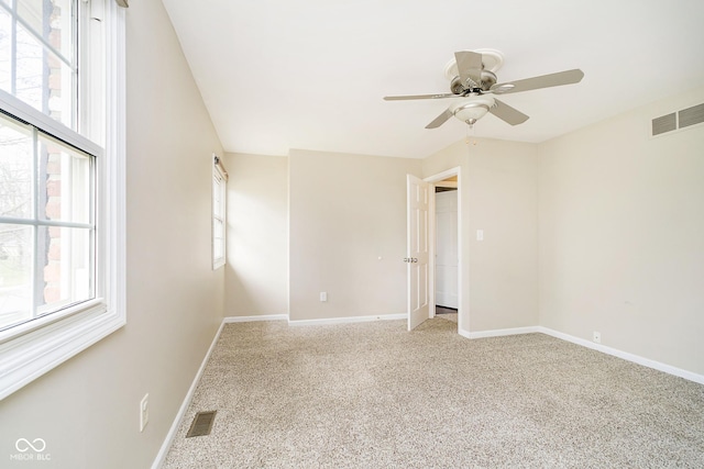 10245 Briar Creek Ln, Carmel, IN 46033 - carpeted spare room with a ceiling fan, healthy amount of natural light, and baseboards