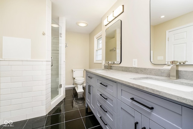 10245 Briar Creek Ln, Carmel, IN 46033 - bathroom featuring double vanity, toilet, a shower stall, tile patterned flooring, and recessed lighting