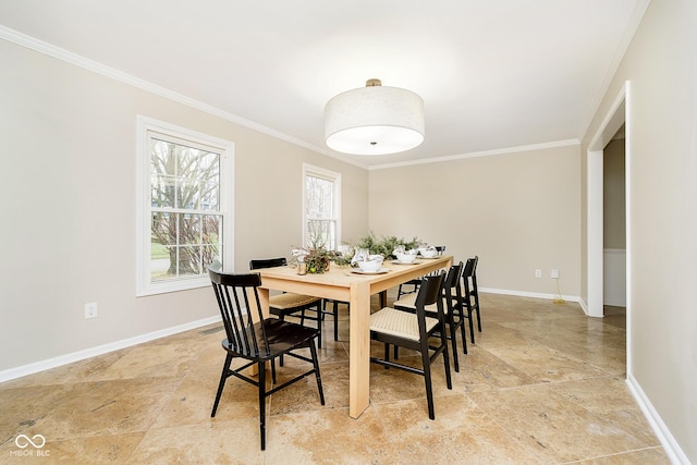 10245 Briar Creek Ln, Carmel, IN 46033 - dining space with crown molding, baseboards, and light stone finish floors