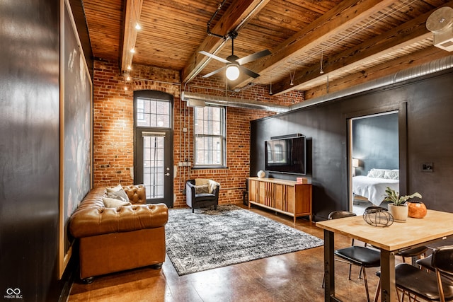 55 S Harding St Unit 308, Indianapolis, IN 46222 - living area featuring wood ceiling with exposed beams, ceiling fan, and brick wall