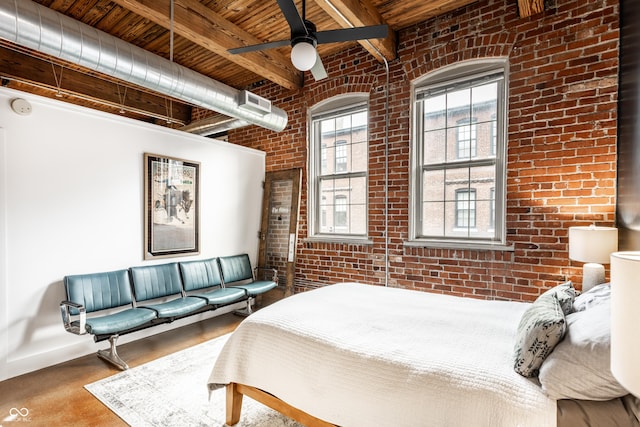 55 S Harding St Unit 308, Indianapolis, IN 46222 - bedroom featuring brick wall, multiple windows, wood ceiling with exposed beams, baseboards, and a ceiling fan