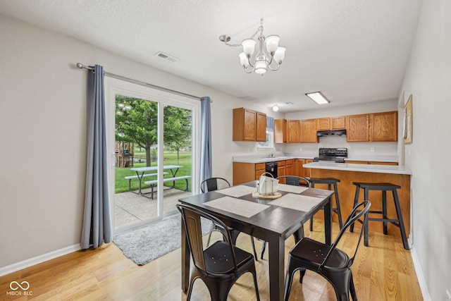 764 Port Dr, Avon, IN 46123 - dining area with light wood-type flooring, a chandelier, and baseboards