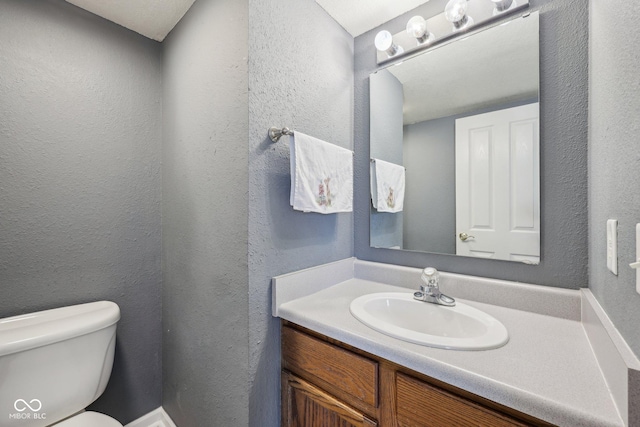 764 Port Dr, Avon, IN 46123 - half bathroom featuring toilet, vanity, and a textured wall