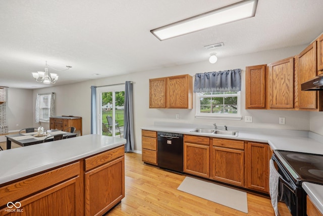 764 Port Dr, Avon, IN 46123 - kitchen with black appliances, a sink, light wood-style floors, and light countertops