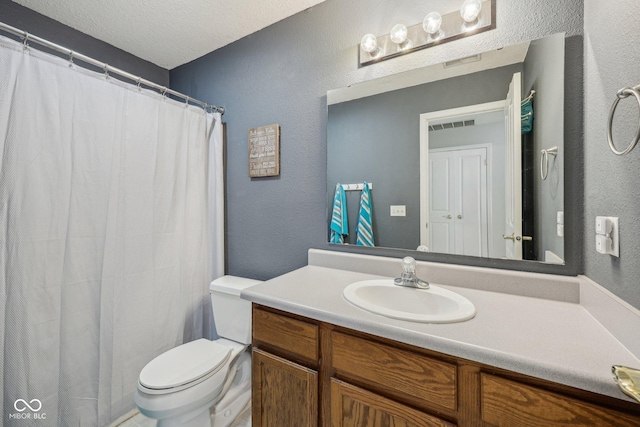 764 Port Dr, Avon, IN 46123 - bathroom with a textured wall, vanity, toilet, and curtained shower