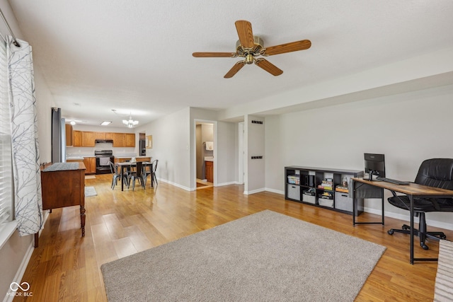 764 Port Dr, Avon, IN 46123 - home office featuring light wood-style flooring, a ceiling fan, and baseboards