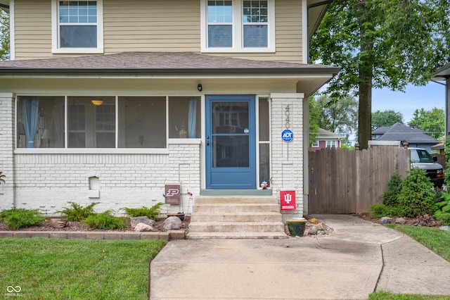 4040 Carrollton Ave, Indianapolis, IN 46205 - doorway to property with brick siding and a shingled roof
