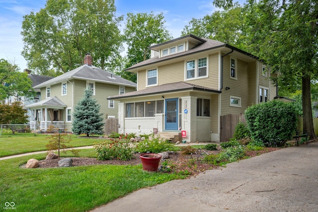 4040 Carrollton Ave, Indianapolis, IN 46205 - traditional style home featuring entry steps, a sunroom, and a shingled roof