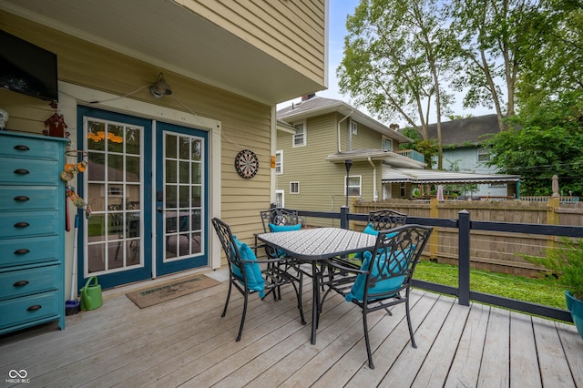 4040 Carrollton Ave, Indianapolis, IN 46205 - wooden deck featuring outdoor dining area and french doors