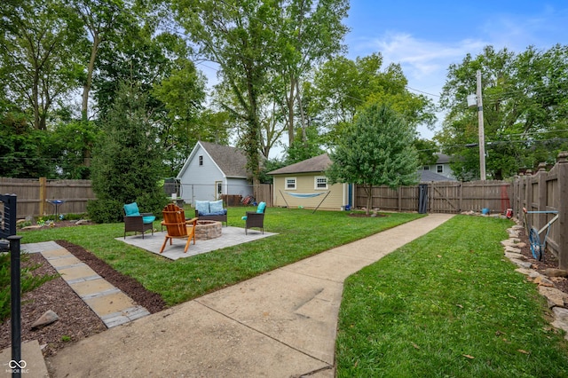 4040 Carrollton Ave, Indianapolis, IN 46205 - view of yard with a fire pit, a patio, and an outbuilding