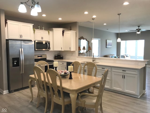 9106 Hedley Way E, Avon, IN 46123 - dining area featuring recessed lighting, light wood finished floors, and ceiling fan