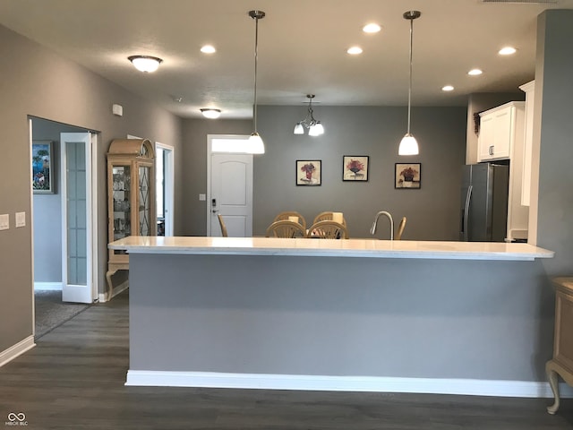 9106 Hedley Way E, Avon, IN 46123 - kitchen with stainless steel fridge with ice dispenser, dark wood finished floors, white cabinetry, baseboards, and recessed lighting