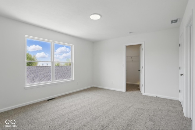 3947 Wren Dr, Brownsburg, IN 46112 - unfurnished bedroom with carpet, baseboards, a walk in closet, and a closet