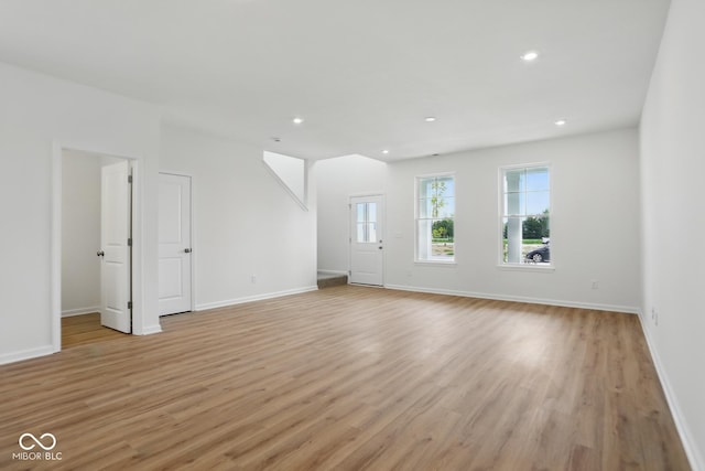3947 Wren Dr, Brownsburg, IN 46112 - unfurnished living room featuring recessed lighting, light wood finished floors, and baseboards