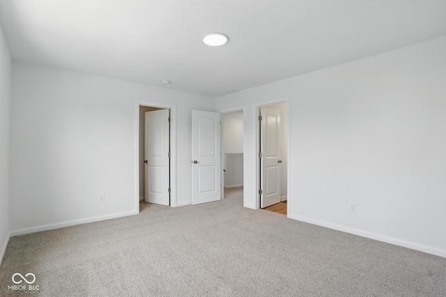 3947 Wren Dr, Brownsburg, IN 46112 - unfurnished bedroom featuring light colored carpet and baseboards