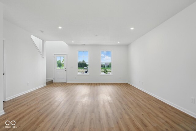 3947 Wren Dr, Brownsburg, IN 46112 - unfurnished living room featuring light wood-type flooring, baseboards, and recessed lighting