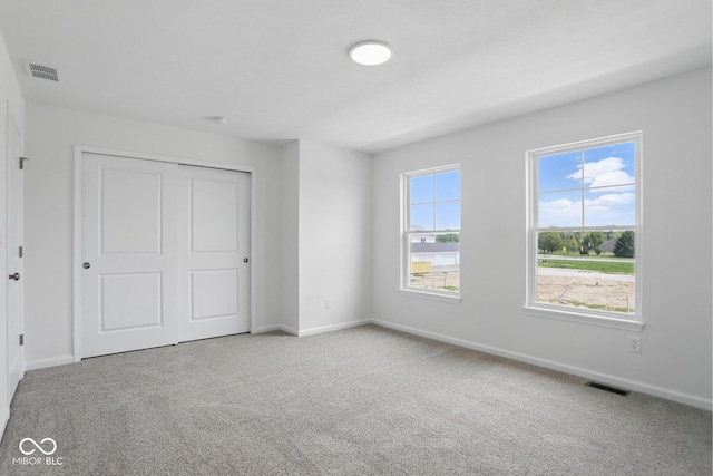 3947 Wren Dr, Brownsburg, IN 46112 - unfurnished bedroom with carpet, baseboards, and a closet