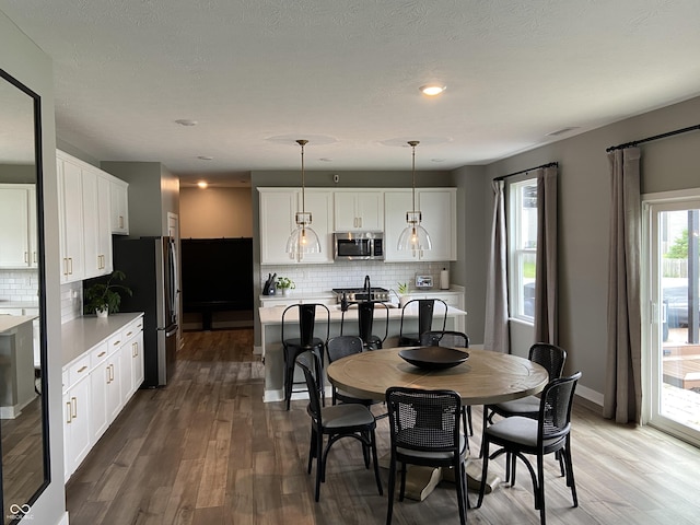 8876 Boylan Pl, Pendleton, IN 46064 - dining space with wood finished floors, baseboards, and recessed lighting