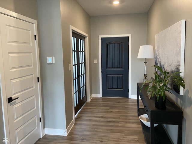 8876 Boylan Pl, Pendleton, IN 46064 - foyer entrance featuring dark wood-style flooring and baseboards