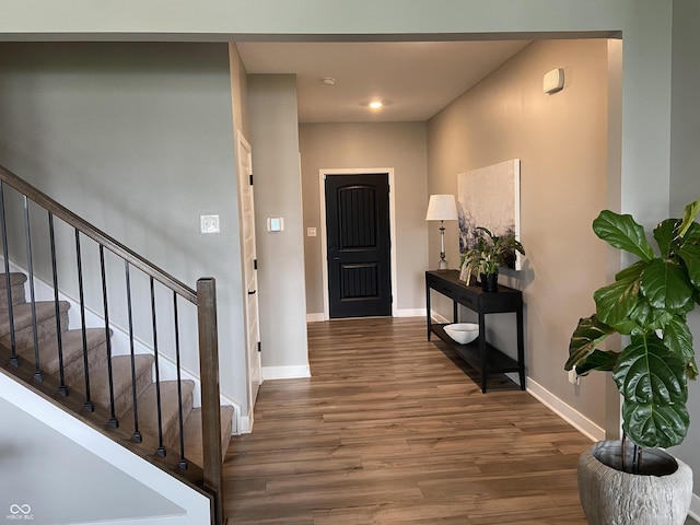 8876 Boylan Pl, Pendleton, IN 46064 - foyer entrance featuring wood finished floors, baseboards, stairway, and recessed lighting