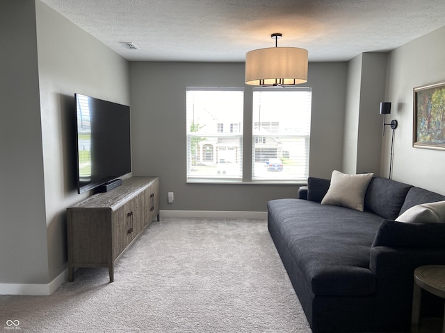 8876 Boylan Pl, Pendleton, IN 46064 - living area with light colored carpet, baseboards, and a textured ceiling
