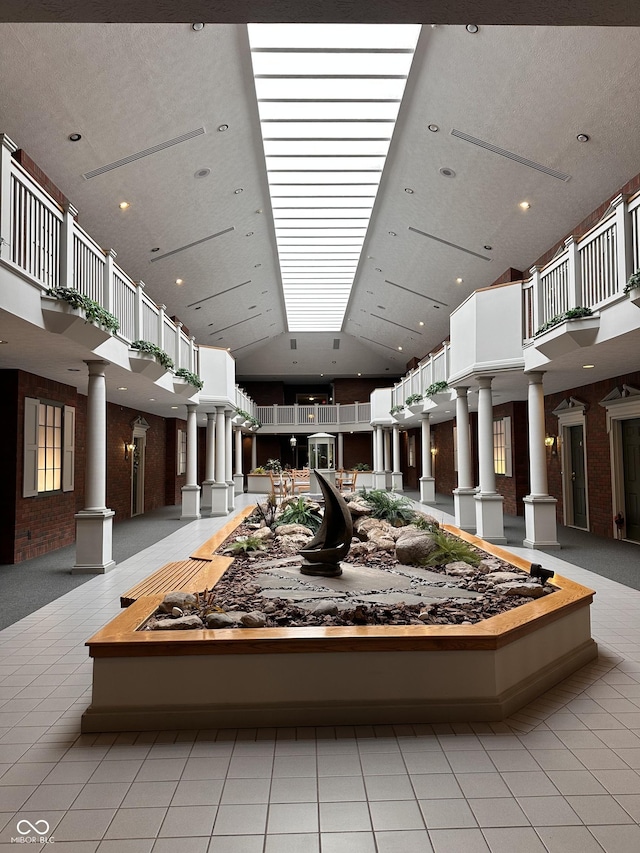 7601 Newport Bay Dr Unit 203, Indianapolis, IN 46240 - building lobby featuring high vaulted ceiling