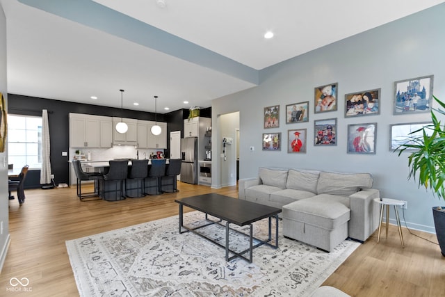 17359 Wilkes Way, Westfield, IN 46074 - living area with light wood-type flooring, baseboards, and recessed lighting