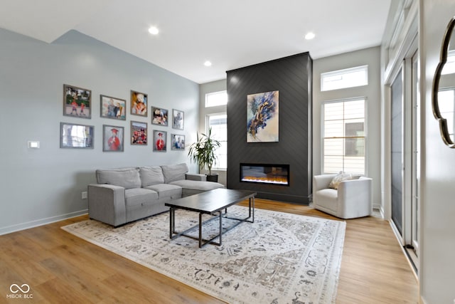 17359 Wilkes Way, Westfield, IN 46074 - living room featuring healthy amount of natural light, light wood-style flooring, a fireplace, baseboards, and recessed lighting