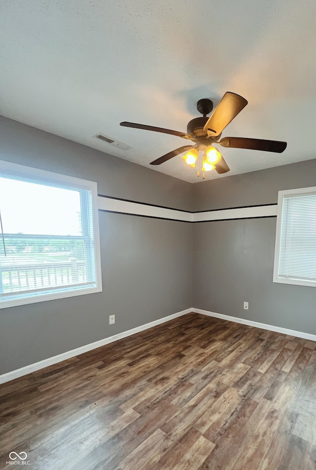 6460 W US Highway 50, North Vernon, IN 47265 - unfurnished room with wood finished floors, baseboards, and a ceiling fan