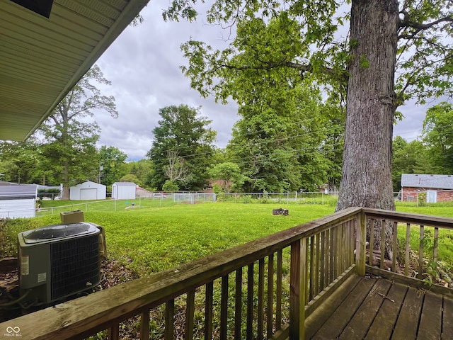 6460 W US Highway 50, North Vernon, IN 47265 - deck with central air condition unit and an outdoor structure