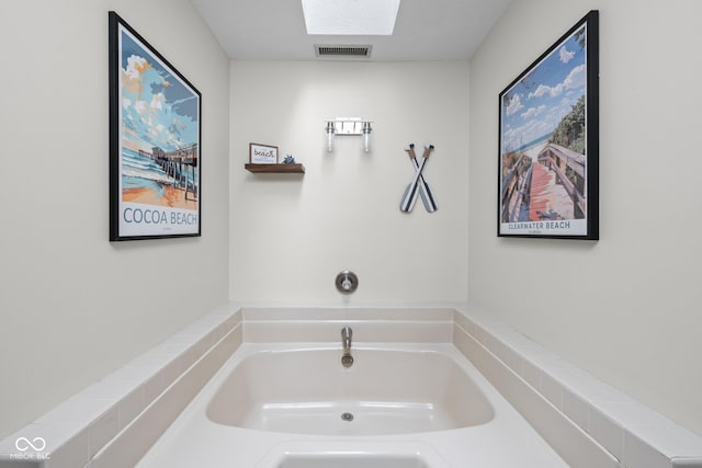 5412 Green Hills Dr, Brownsburg, IN 46112 - bathroom with a skylight and a garden tub
