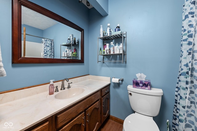 5412 Green Hills Dr, Brownsburg, IN 46112 - full bath featuring vanity, toilet, wood finished floors, and a shower with shower curtain