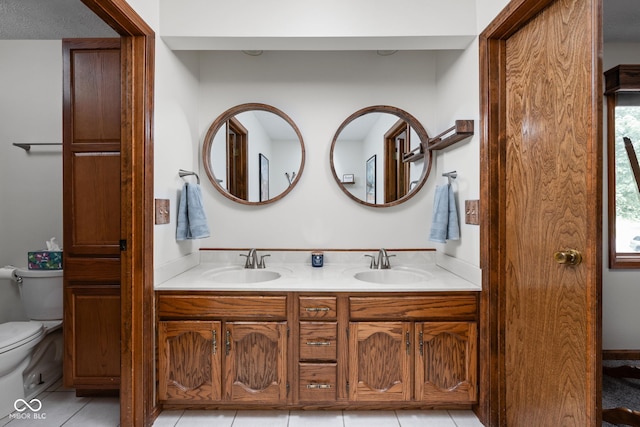 5412 Green Hills Dr, Brownsburg, IN 46112 - bathroom with double vanity, toilet, and tile patterned flooring